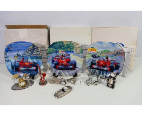 Three boxed Ferrari collector plates and a quantity of novelty miniature clocks in the form of musical instruments and motor 
