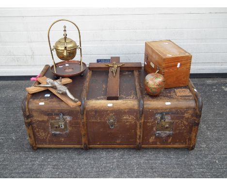A Steamer trunk measuring approximately 92cm long, 52cm wide and 33cm deep. The trunk has a collection of; 2 church crosses, 