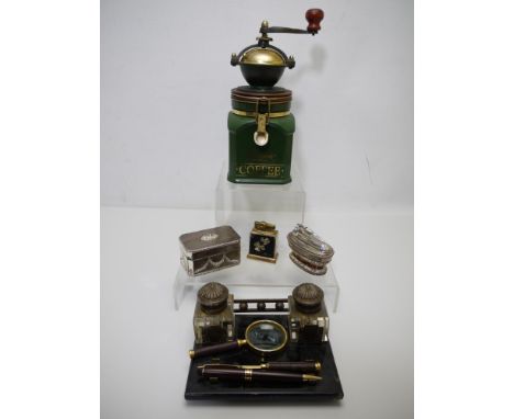 Lot to include a vintage two inkwell desk stand / tidy, a Harrods coffee grinder and cigarette lighters. [W]