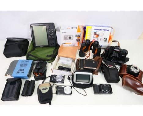 A collection of cameras, satnav, binoculars; a Canon Ixus132 HD, a Kodak Brownie 620, among similar items. All items are unte
