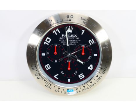 A clock / watch dealers advertising display wall clock, black dial with Arabic numerals, three subsidiary dials, 33.5 cm (d).