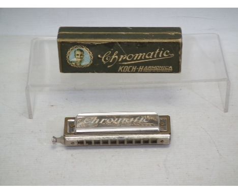 Koch Harmonica Made in Germany in original box. Appears to be in Good condition in a Good box. (This does not constitute a gu