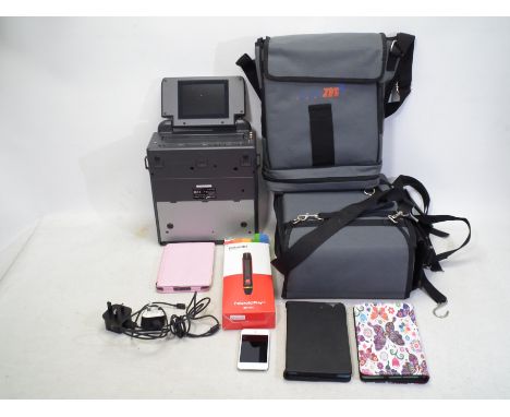 A collection of Amazon tablets, ipod 8GB, Amazon Kindle and Polaroid electric 3D pen and 2 ToadM3 portable VHS players in bag