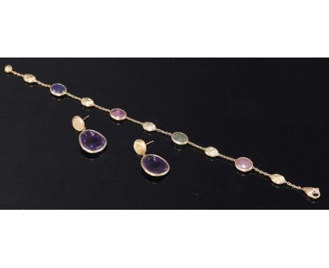 A gold 'Siviglia' gemstone bracelet by Marco Bicego,with assorted oval double rose cut sapphires, all spectacle set between s