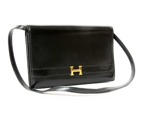 An Hermès vintage black 'Annie' clutch bag, with detachable strap, gold tone hardware, opening to sectioned interior with sli
