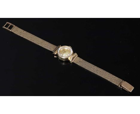 A ladies' 9ct gold Tissot mechanical watch, c.1950,on a later 9ct gold brick link bracelet, c.1960. The case, 17mm diameter, 