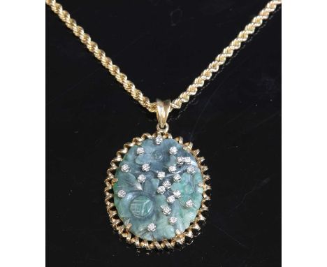 A Continental jade and diamond pendant, with a carved and pierced oval nephrite jade plaque, scattered with brilliant cut dia