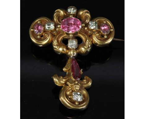 A Victorian cased gold-foiled topaz and chrysolite brooch, c.1840,of scrolling lozenge form. Three graduated oval foil-backed