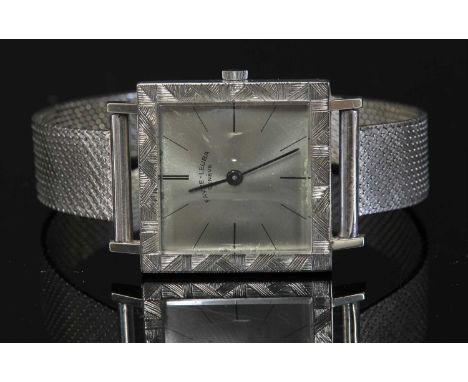 An 18ct white gold Favre-Leuba mechanical bracelet watch, c.1960,a square case, 27mm in diameter, silvered dial with black ba