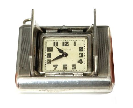 An Art Deco Swiss sterling silver Art Deco purse watch, c.1929,by Tavannes, Schwob Frères & Co. A rectangular squeeze action 