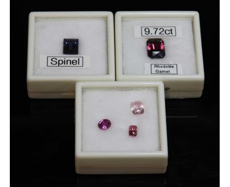 Five assorted unmounted gemstones,to include a rectangular step cut blue spinel of 5.13ct, a scissor cut rhodolite garnet of 