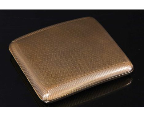 A 9ct gold cushion-shaped curved cigarette case, with engine turned fox head decoration to each side, with a wavy border. Lon