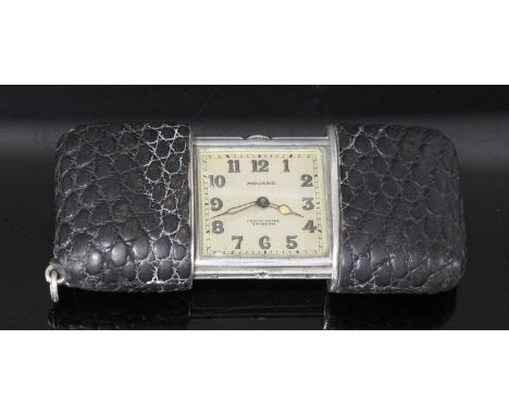 An Art Deco silver Movado 'Ermeto' chronometer mechanical purse watch,with a black alligator case. A square silvered dial wit