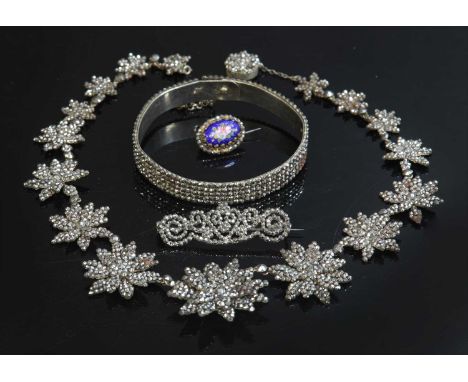 An early Victorian cut steel graduated star necklace, c.1840,with a series of graduated, layered, cut steel stars, to a box c