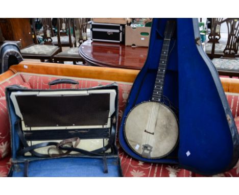 A cased banjo, The Windsor Popular Model 3, together with a Pietor mother of pearl accordion (2)