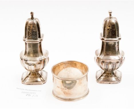 A pair of Edwardian silver salt and pepper pots, square baluster form, London 1909; together with a silver napkin ring (3) 