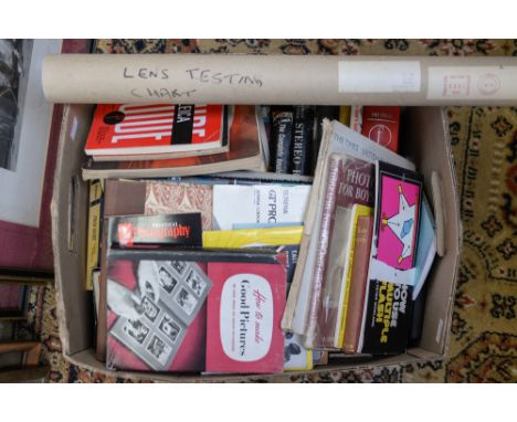 A collection of camera and photography books including Leica guides 