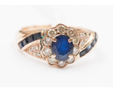 A sapphire and diamond dress ring.