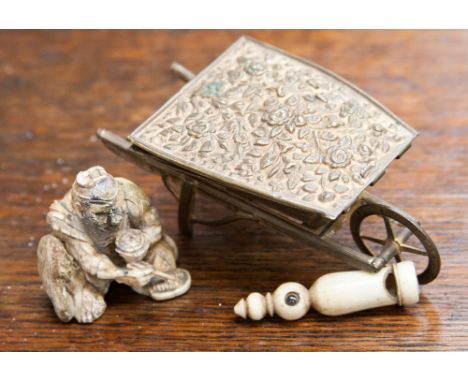 An early 20th Century wheelbarrow stamp box, a stanhope whistle with memories of Leicester and a Netsuke (a/f) Meiji.