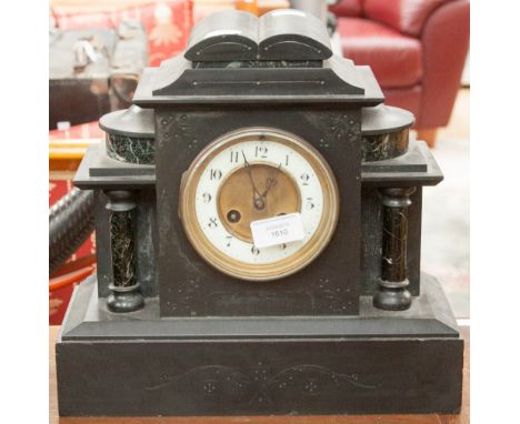 A late Victorian black slate mantle clock of architectural form, arabic numerals
