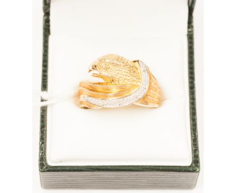 An eagle head 9ct yellow gold and diamond studded ring, approx 5.7 grams 