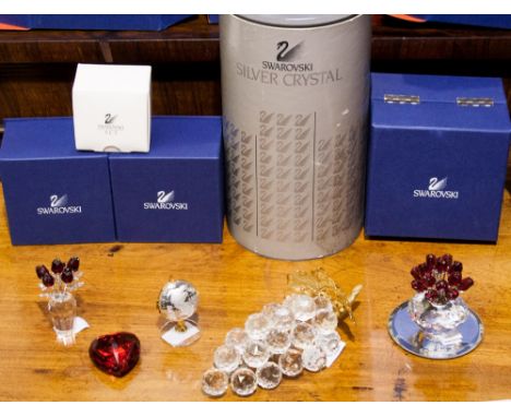 A boxed Swarovski bunch of grapes, with two boxed flowers in vases, a boxed globe, and a boxed heart (5 items)