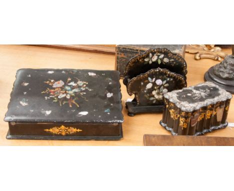 A late Victorian black lacquered writing slope inlaid with mother of pearl decoration and gilding; together with a similar le