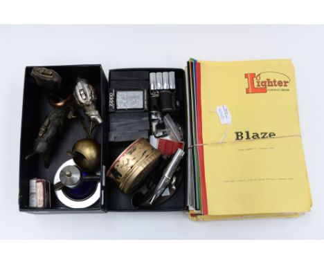 Two boxes of assorted table and cigarette lighters, including  Zippo and novelty examples in the form of a bull, a camel, pis