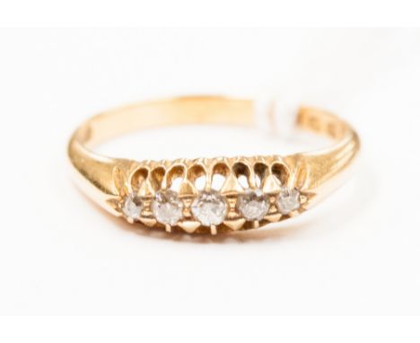 An 18ct gold five stone diamond ring, each claw set with a gallery setting, ring size 'K', 3 grams approx 