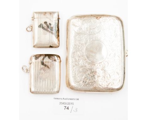 An Edwardian silver cigarette case, Birmingham 1908, together with two rectangular silver vesta cases, both engine turned, Bi