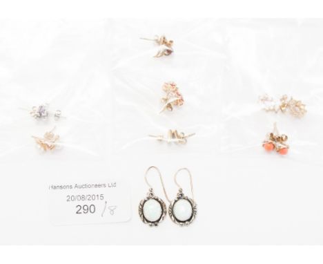 A pair of two colour gold diamond earrings, pair of opal and ruby cluster earrings and five other pairs of stud earrings, dro