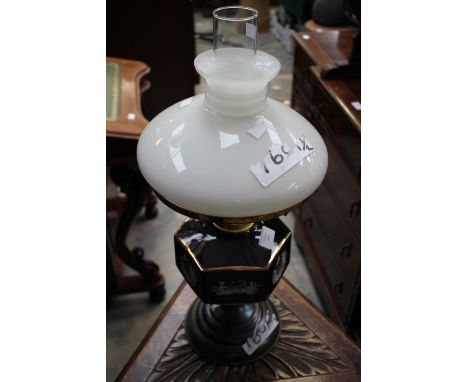 An oil lamp with black and white base.