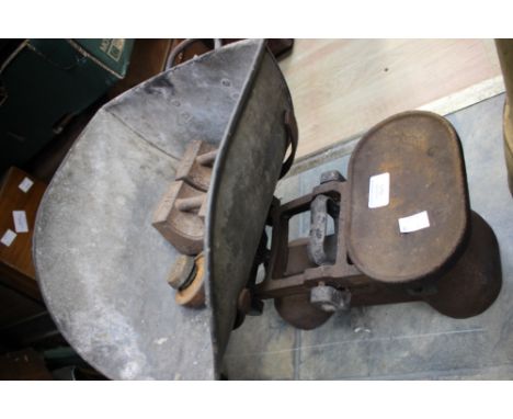 A set of green grocer scales and weights, some brass 