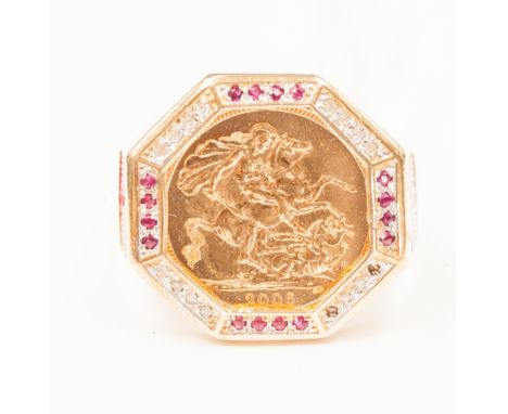 A half sovereign ring set in yellow metal ring.
