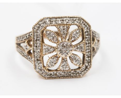 A 9ct ring, with openwork mount set, numerous diamonds