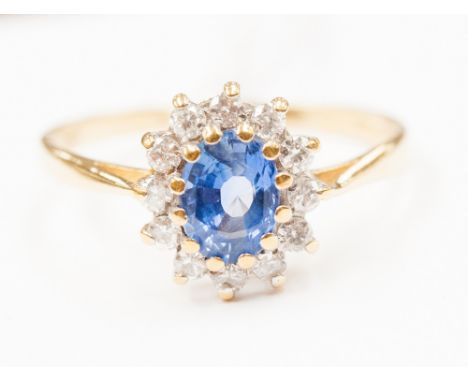 An 18ct gold sapphire and diamond cluster ring, ring size 'R', three grams approx 