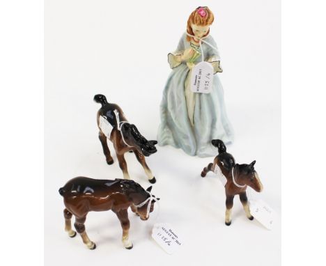 A Royal Worcester figure 'Sweet Anne' model no 3630 by Freda Doughty, together with three Beswick foals, s.d. (4)