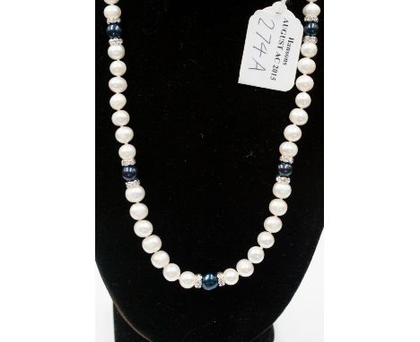 A White and Black Freshwater Pearl single strand necklace, fitted with approximately 53 pearls in total, each of approximatel