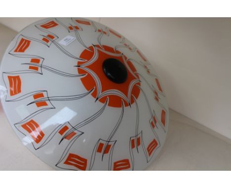 A mid 20th Century glass light shade uplight, opaque white printed with an abstract orange and black design, by Berry's Elect