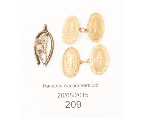 A pair of 9ct gold oval cufflinks and a horseshoe brooch 