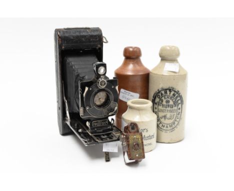 A Bakelite Coronet Midget, camera with a Kodak Bellows camera with three stoneware named pots (5) 