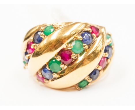 A silver gilt ring marked .925 with ruby, emerald and sapphire stone setting.