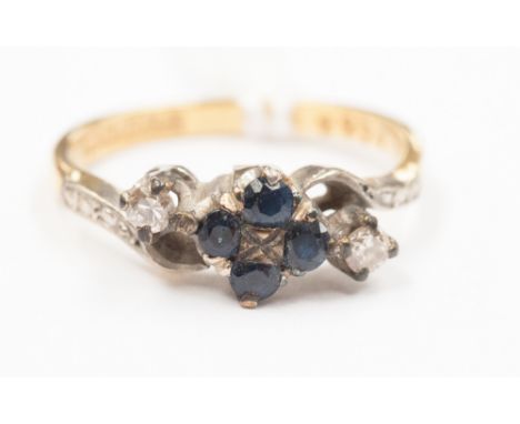 A diamond and sapphire cluster ring on 18ct band 