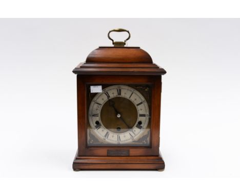 A Georgian style eight day bracket clock, with a silvered chapter dial and three winder holes, with a Westminster chime by El