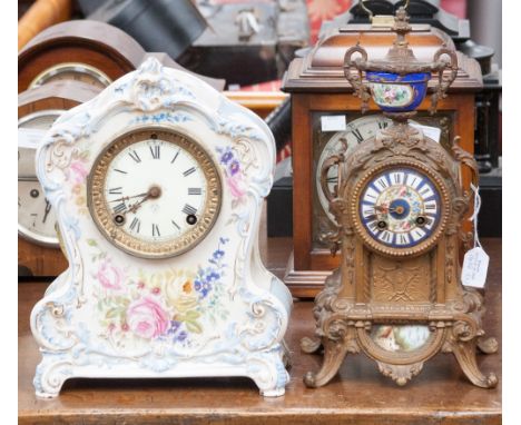 A late 19th Century French bronzed clock with porcelain inset plaques in the Rococo style, together with a late Victorian cer