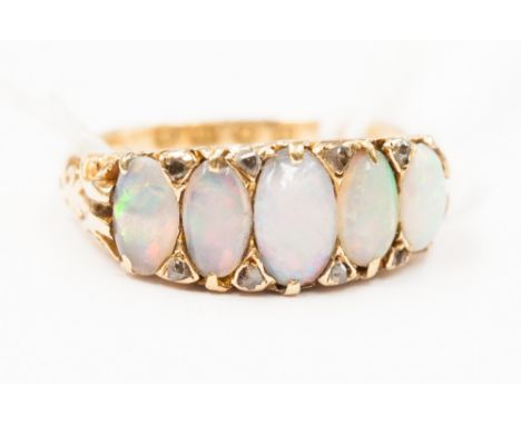 An 18ct gold and five stone opal ring.