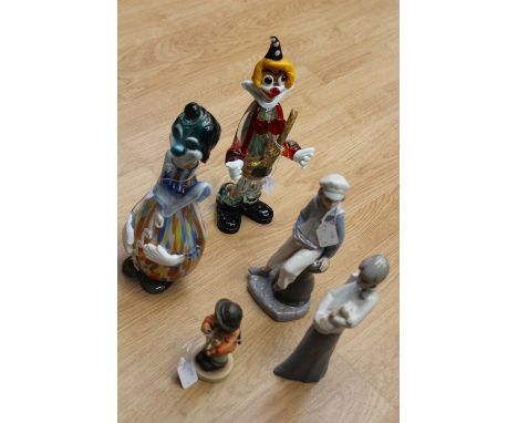 A Murano glass clown decanter together with another Murano glass clown, Lladro figure of a boy clutching a yacht, Lladro-type