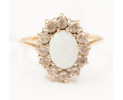 A 9ct gold opal and cz ring.