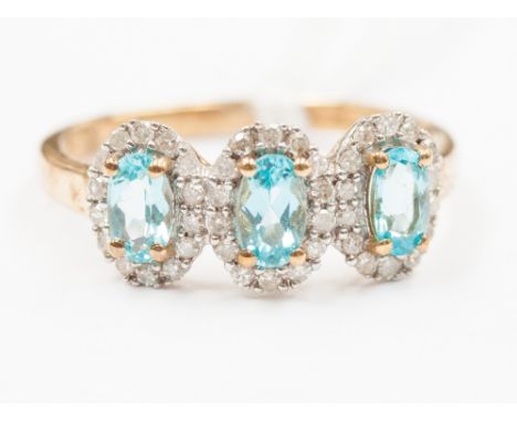 A 9ct ring three stone apatite with diamonds 