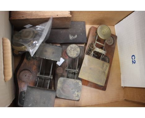 A box of Victorian/Edwardian scales and weights, including a set of postal scales 